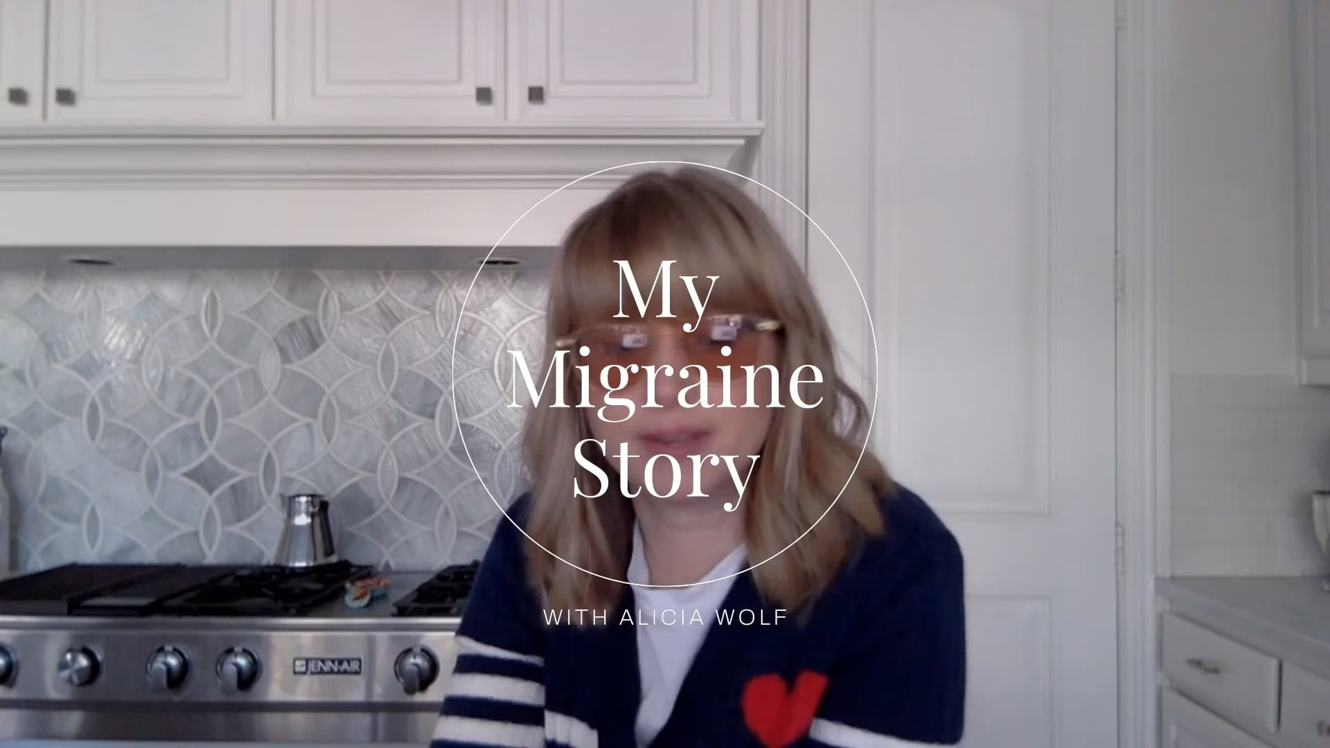 Alicia Wolf of Dizzy Cook in her kitchen sharing her migraine story while wearing Avulux migraine glasses.