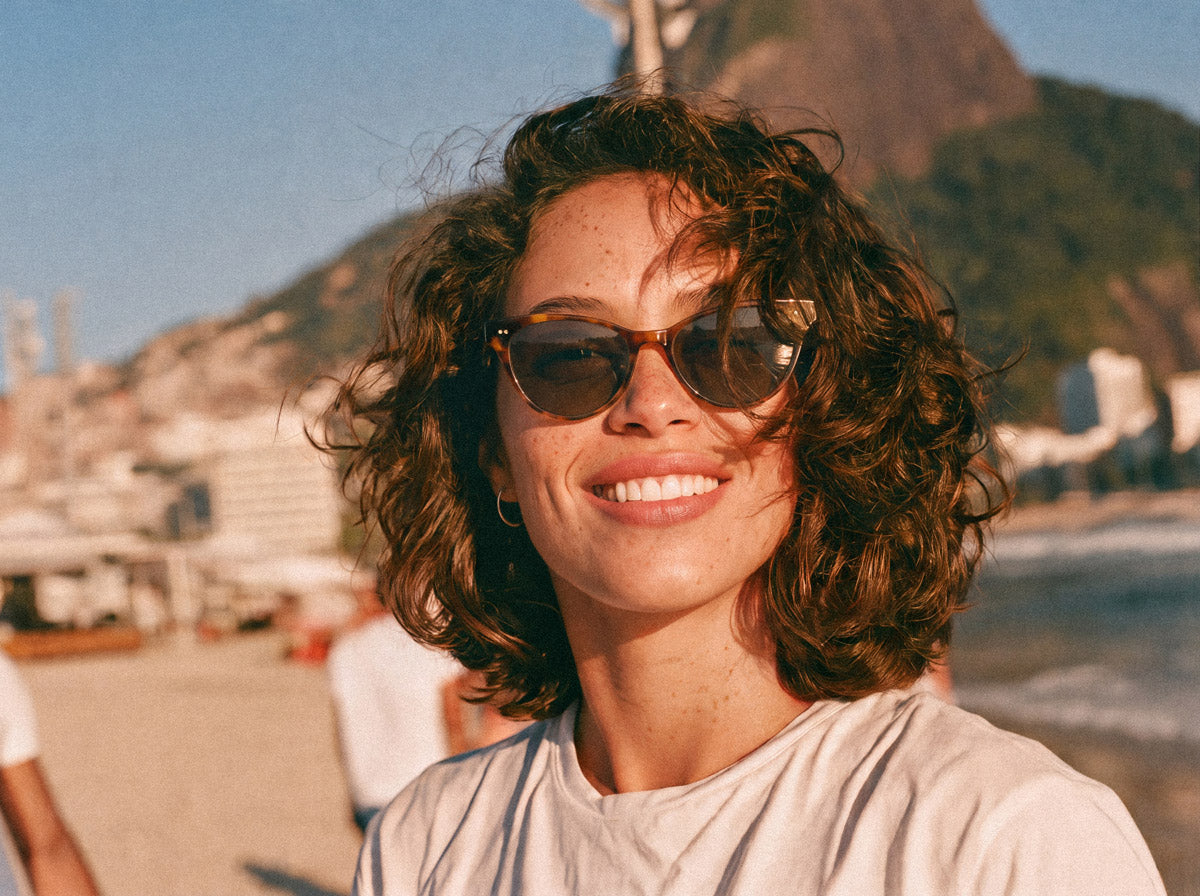 Woman wearing Avulux Atlas lenses on the beach